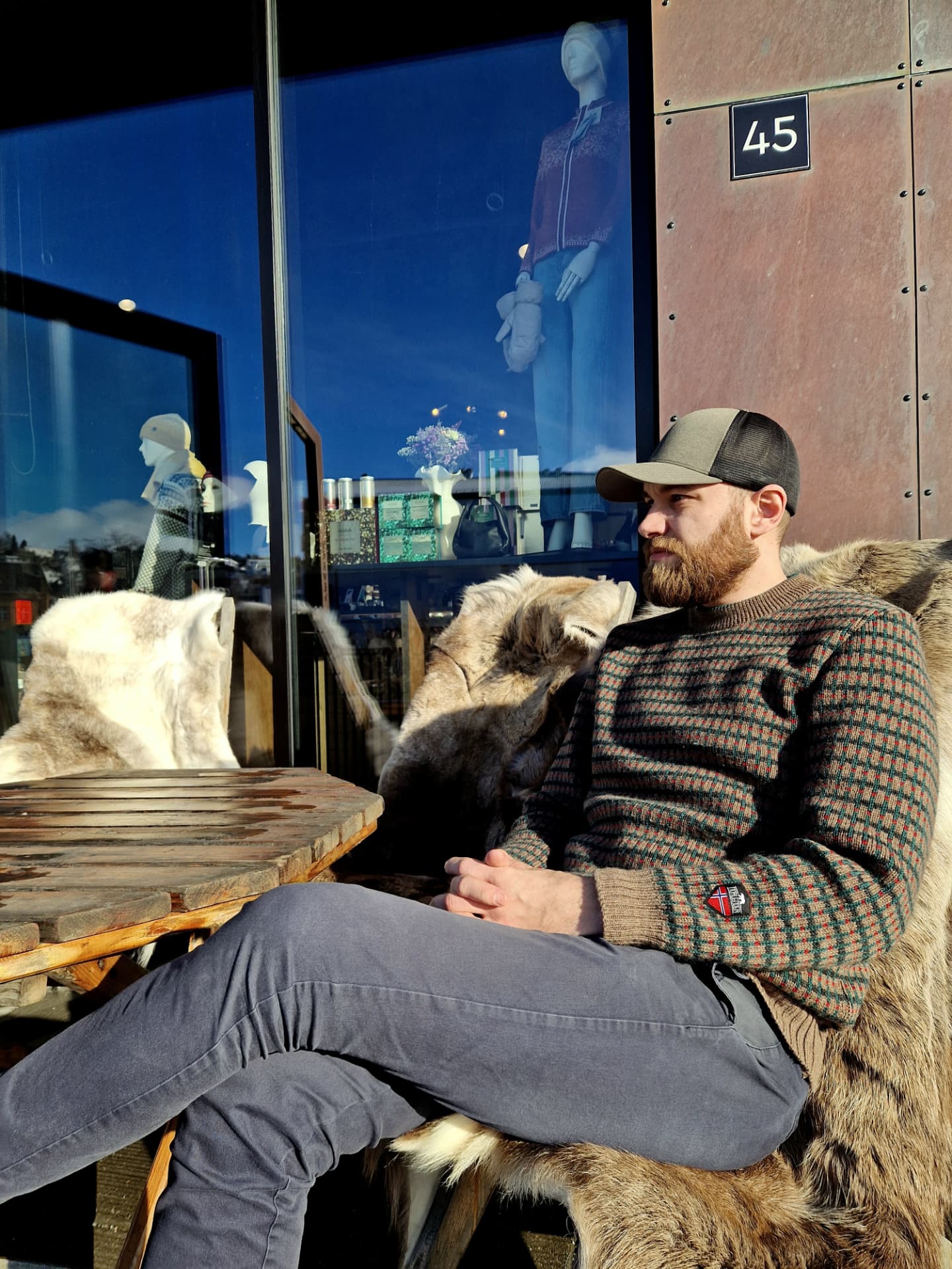 Remy Traasdahl wearing a cap, seated outside The Gift Box at Vervet 45