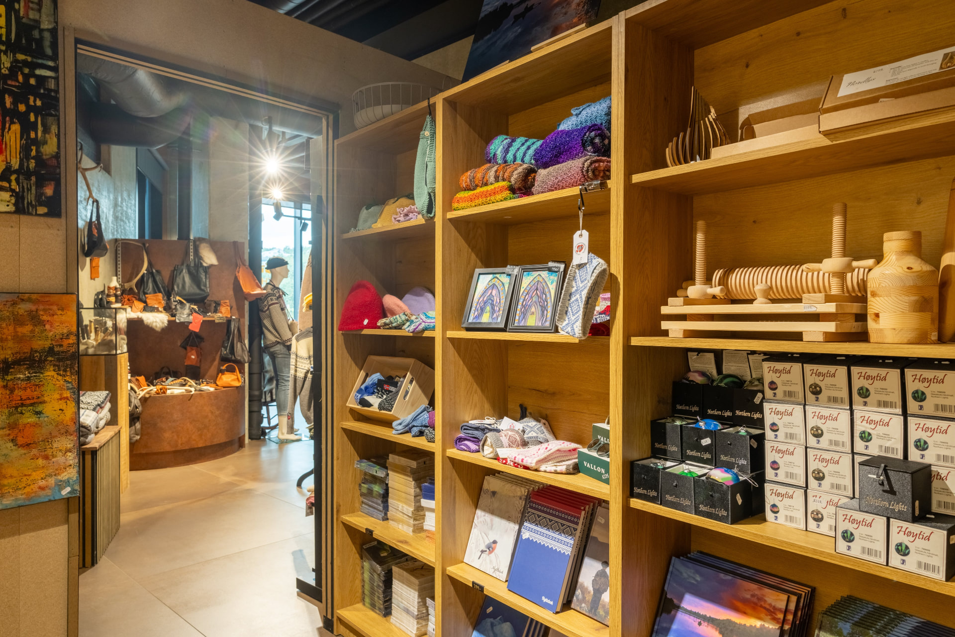 Shelves with knitwear, mittens, art and local products in The Gift Box